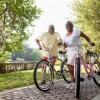 Senior African American couple riding bicycles